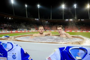 Zurich fans watching a match in a pitchside hot tub